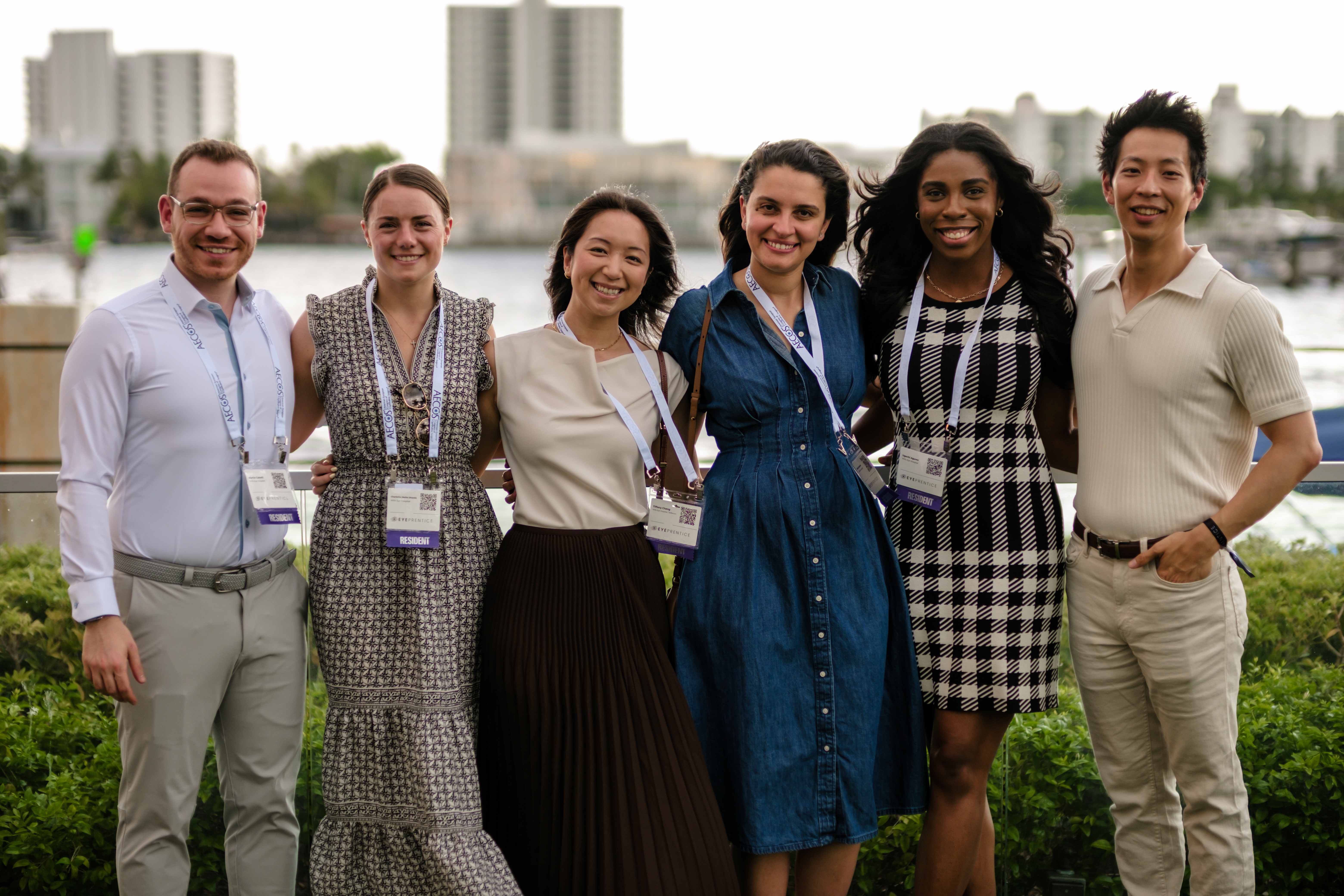 Residents gathered on a waterfront terrace at the Eyeprentice Showcase reception